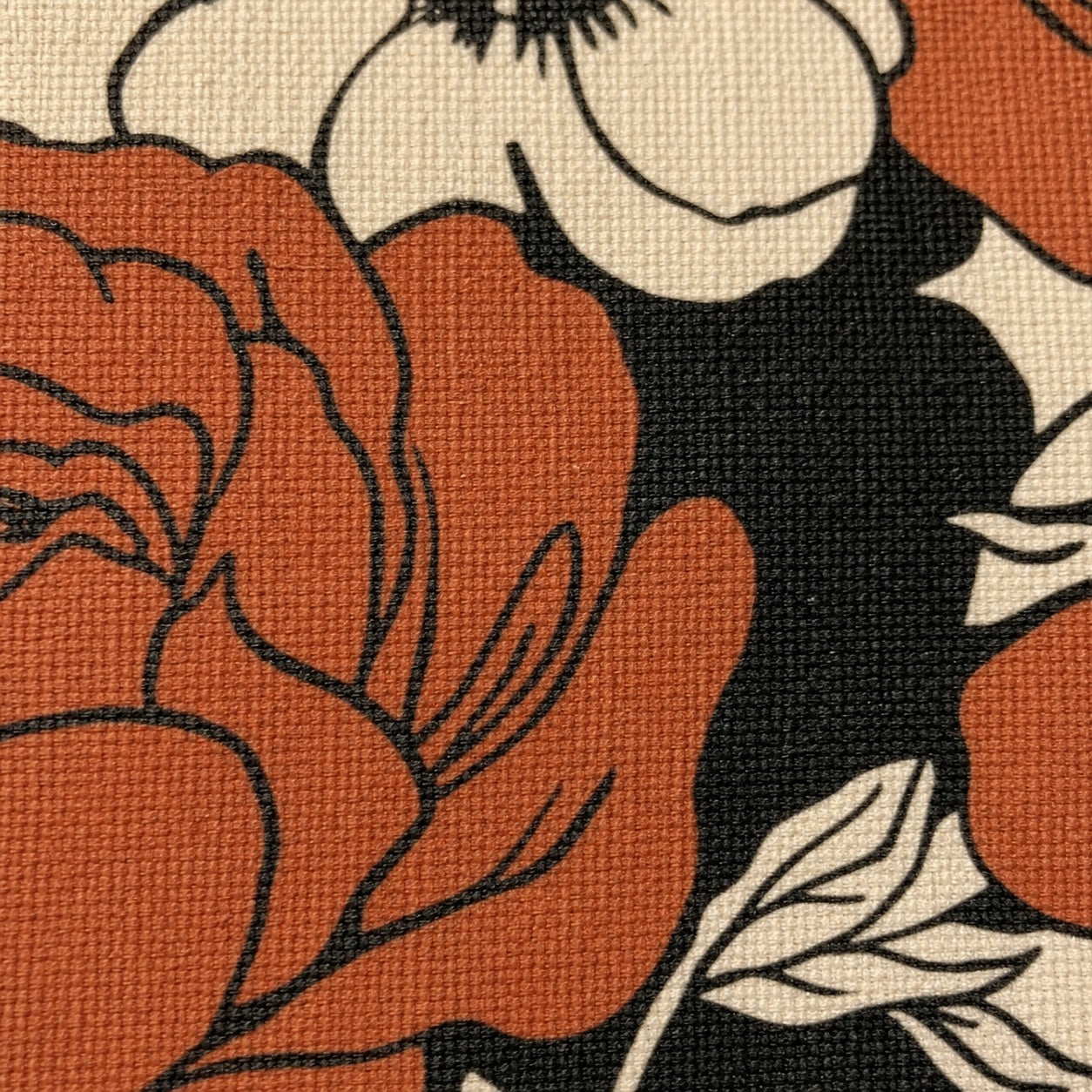 Extreme close-up of the Atelier design printed into the canvas weave
