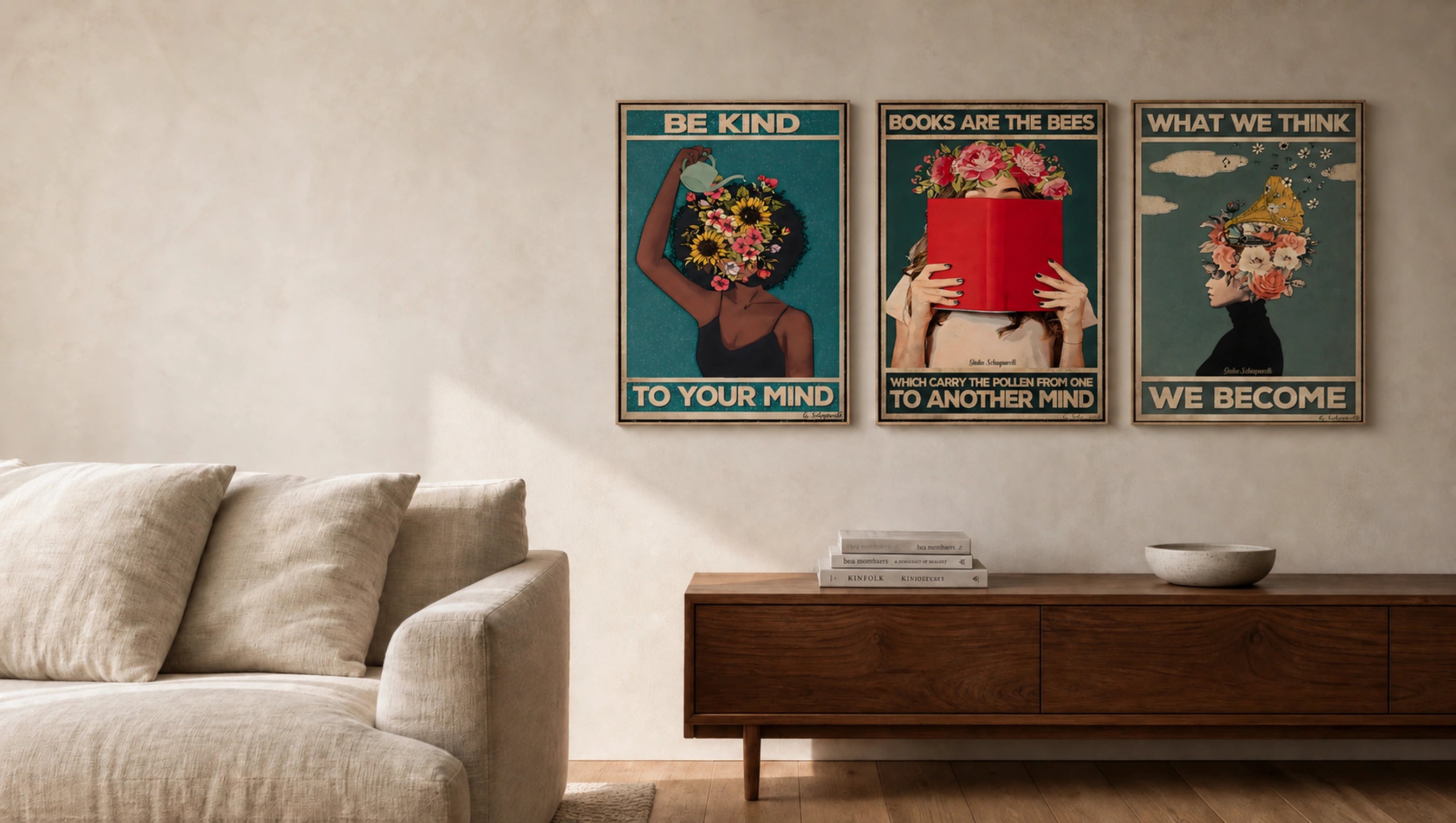 Three Giulia canvases — Be kind to your mind, Books are the bees and What we think, we become — displayed together in a bright living room.
